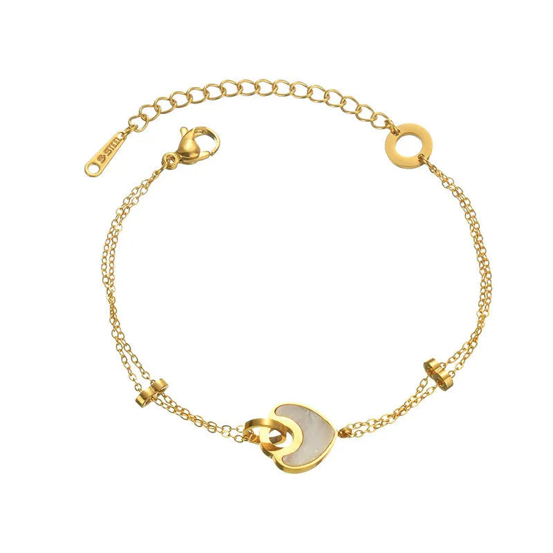 Women's adjustable stainless steel bracelet with a double-layered resin heart charm.