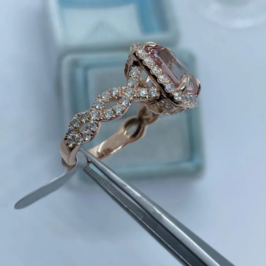 Women's rose gold electroplated alloy geometric ring shown in seven available sizes