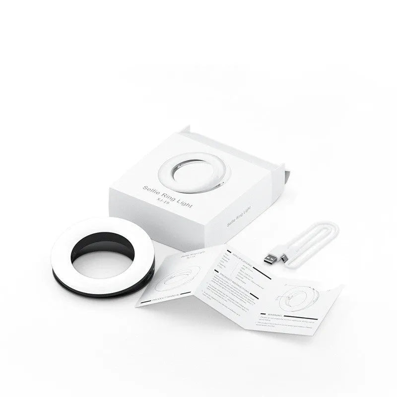 Black LED selfie ring light for mobile phones with adjustable brightness and USB charging port.