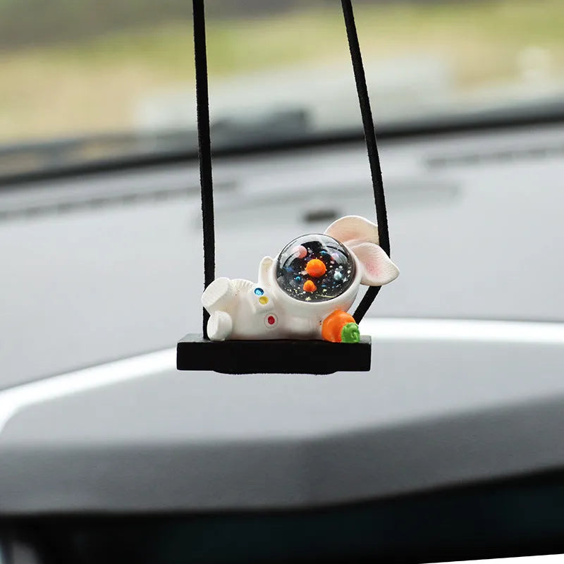 Resin cartoon astronaut car pendant in five designs: telescope, red flag, radish, headrest, and resting astronaut