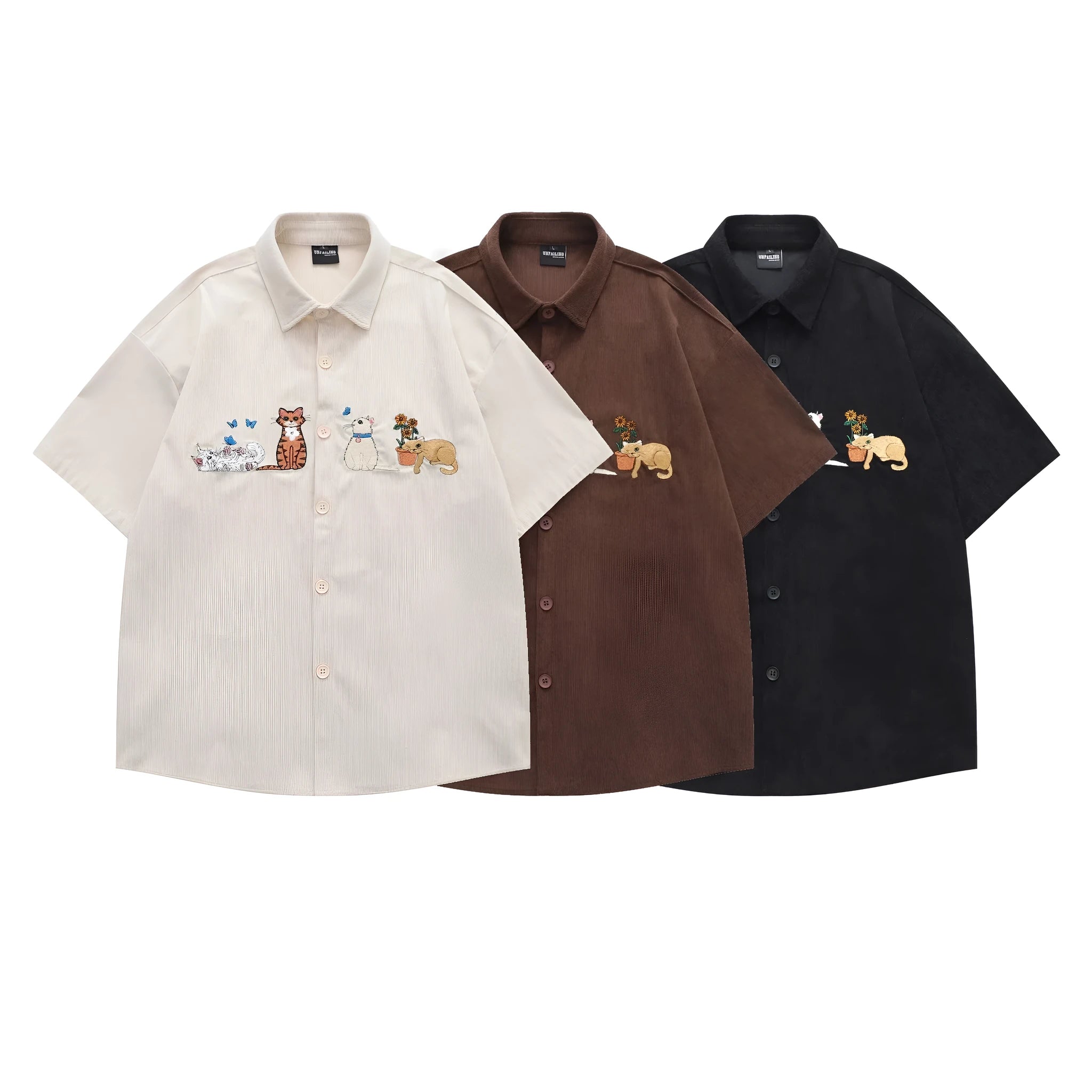 Loose fit cardigan shirt with cartoon embroidery in apricot colour, showing front design.