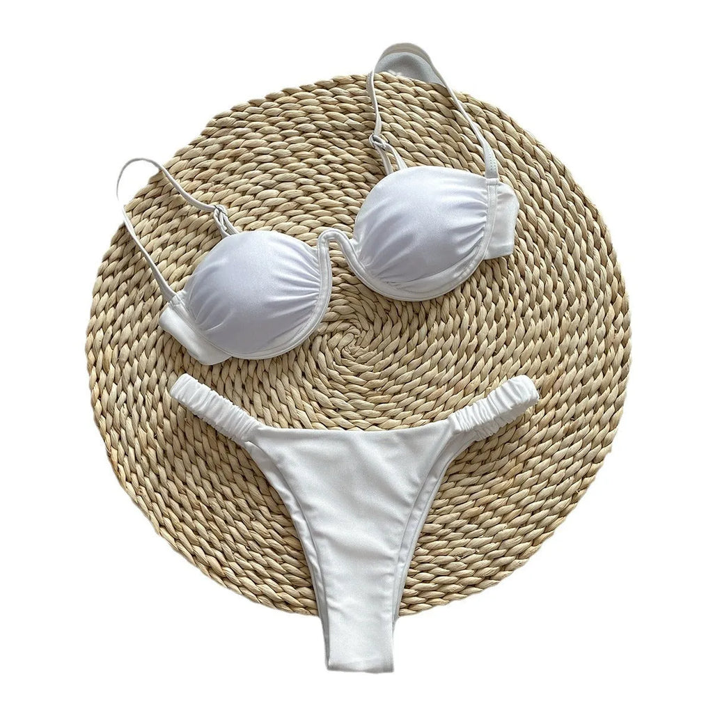 Women's black underwire bikini swimsuit on a mannequin, showing briefs style.