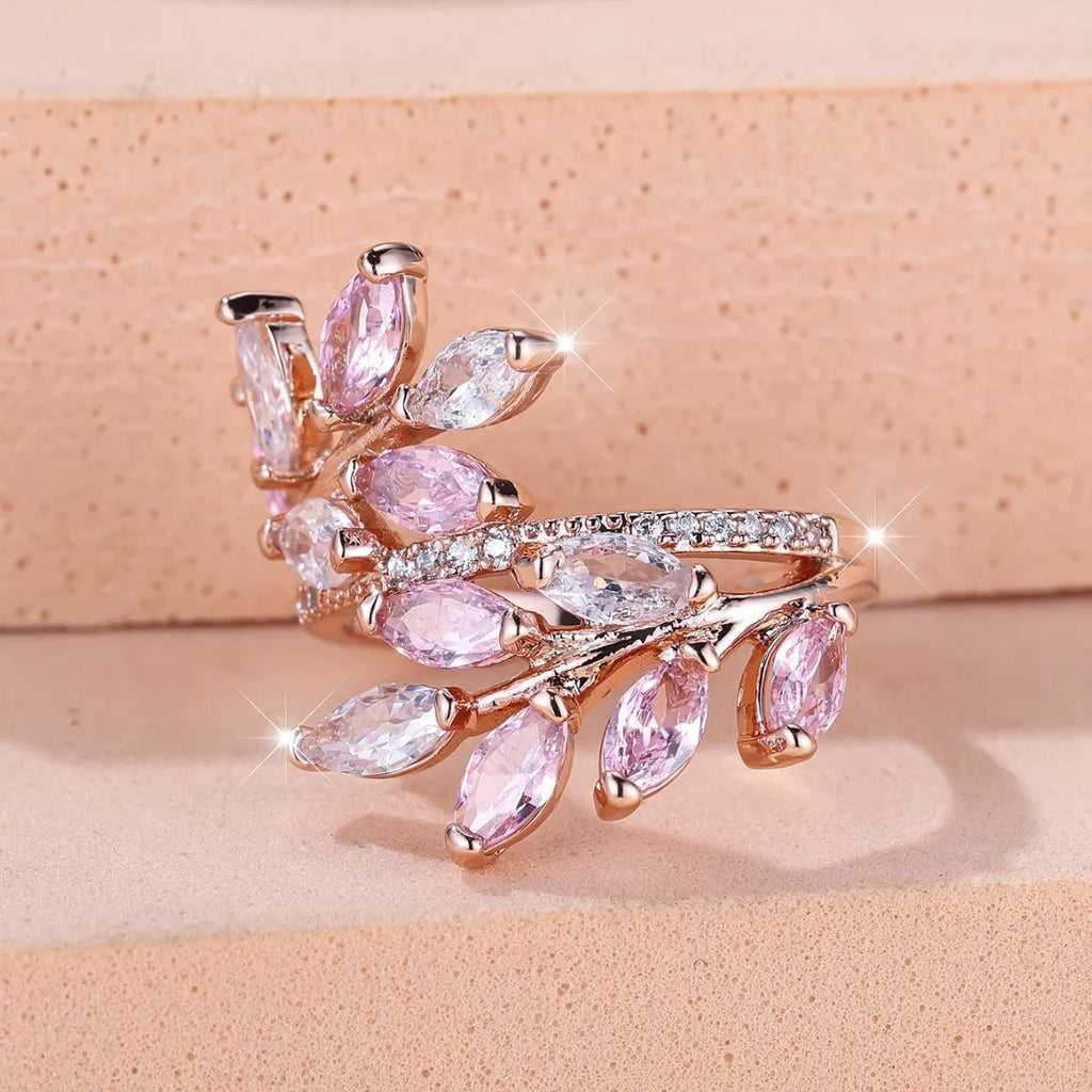 Adjustable copper leaf fashion ring with a central horse eye zircon stone, shown in a rose gold finish.