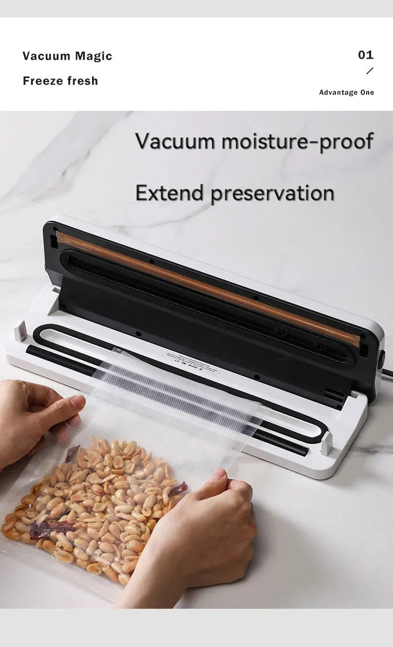 Small black automatic vacuum sealer machine for household food preservation on a kitchen counter