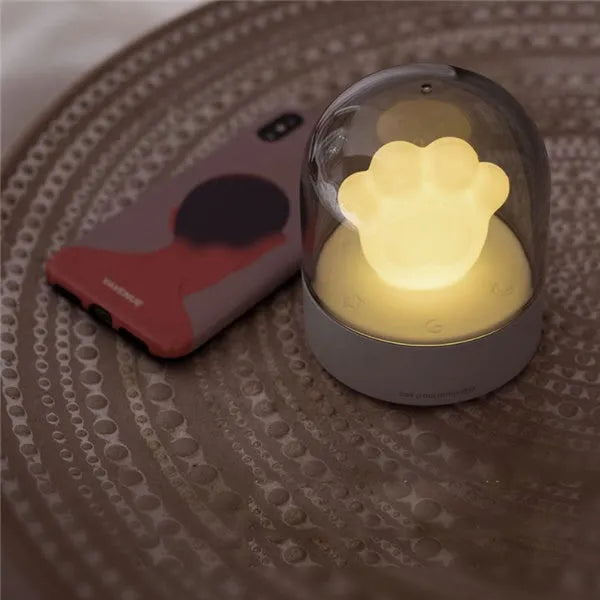 Grey and pink cat paw shaped USB rechargeable musical night light with adjustable brightness