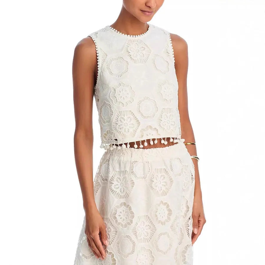 White women's sleeveless top and long skirt suit with embroidery details