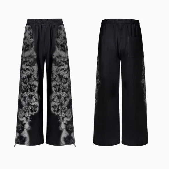 Three-piece streetwear co-ord set showing hoodie, loose trousers and seven-inch shorts with printed collage design