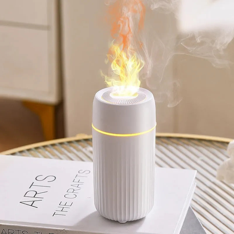 Car aroma diffuser with flame simulation effect showing black and white colour options