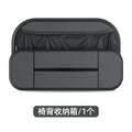 Black leather car seat rear storage bag with compartments, shown mounted on a car seat.