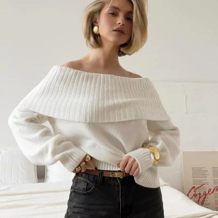 Grey off-the-shoulder sweater with a 3D textured pattern, shown on a model.