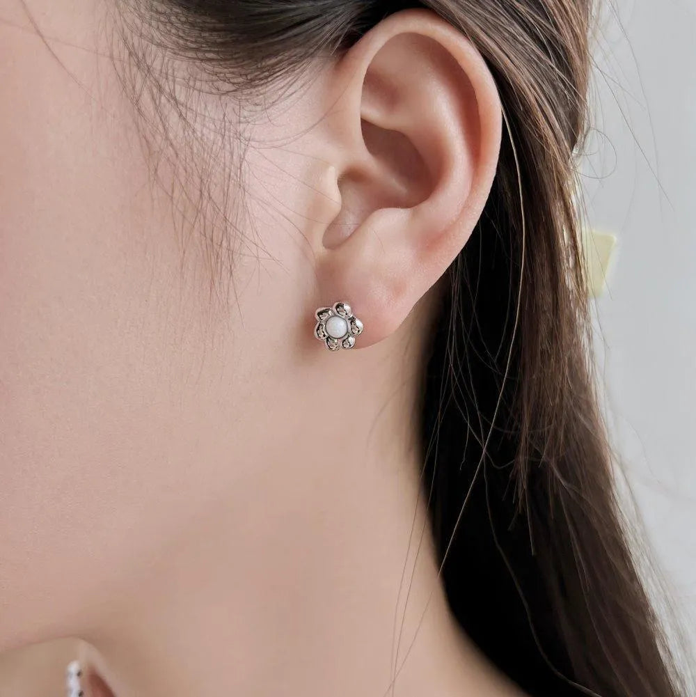 S925 sterling silver black agate flower ear studs in gold colour close up