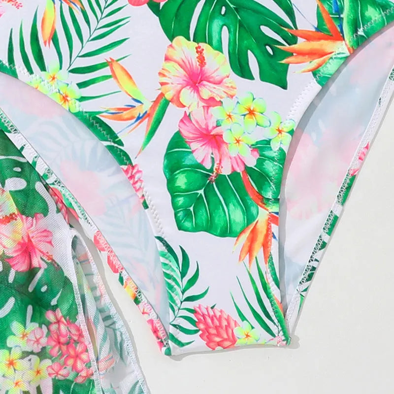 Girls' floral two-piece swimsuit in polyester on a white background, showing briefs style.