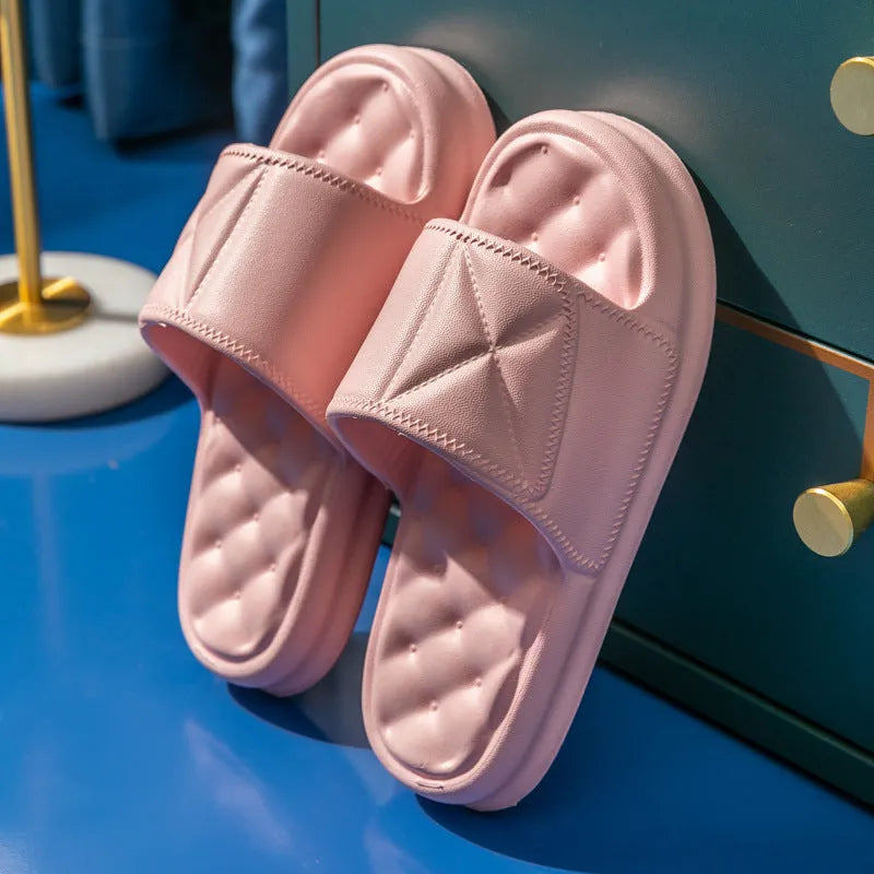 Pair of soft EVA bathroom slippers with a thick non-slip sole, shown in a choice of colours.