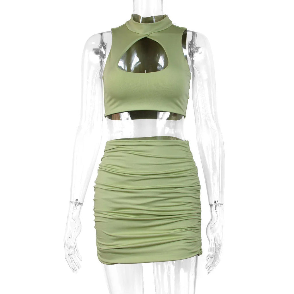 Light purple women's two-piece set featuring a hollow vest top and a matching split skirt on a model.