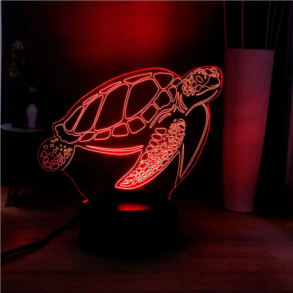 3D acrylic turtle-shaped LED night light with remote control on a shelf.