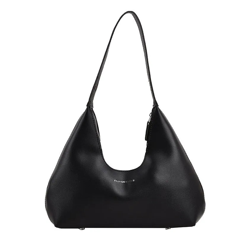 Women's brown retro PU leather shoulder handbag with a pillow shape and single strap.
