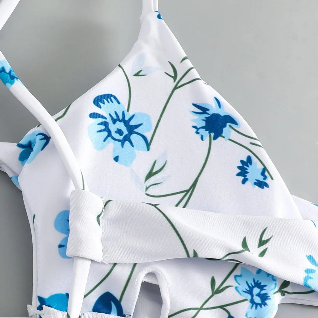 Women's floral pattern swimsuit with tie-neck triangle top and matching shorts