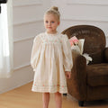 Girls apricot dress with flower embroidery, puff sleeves, and cotton lining, available in heights 90cm to 140cm