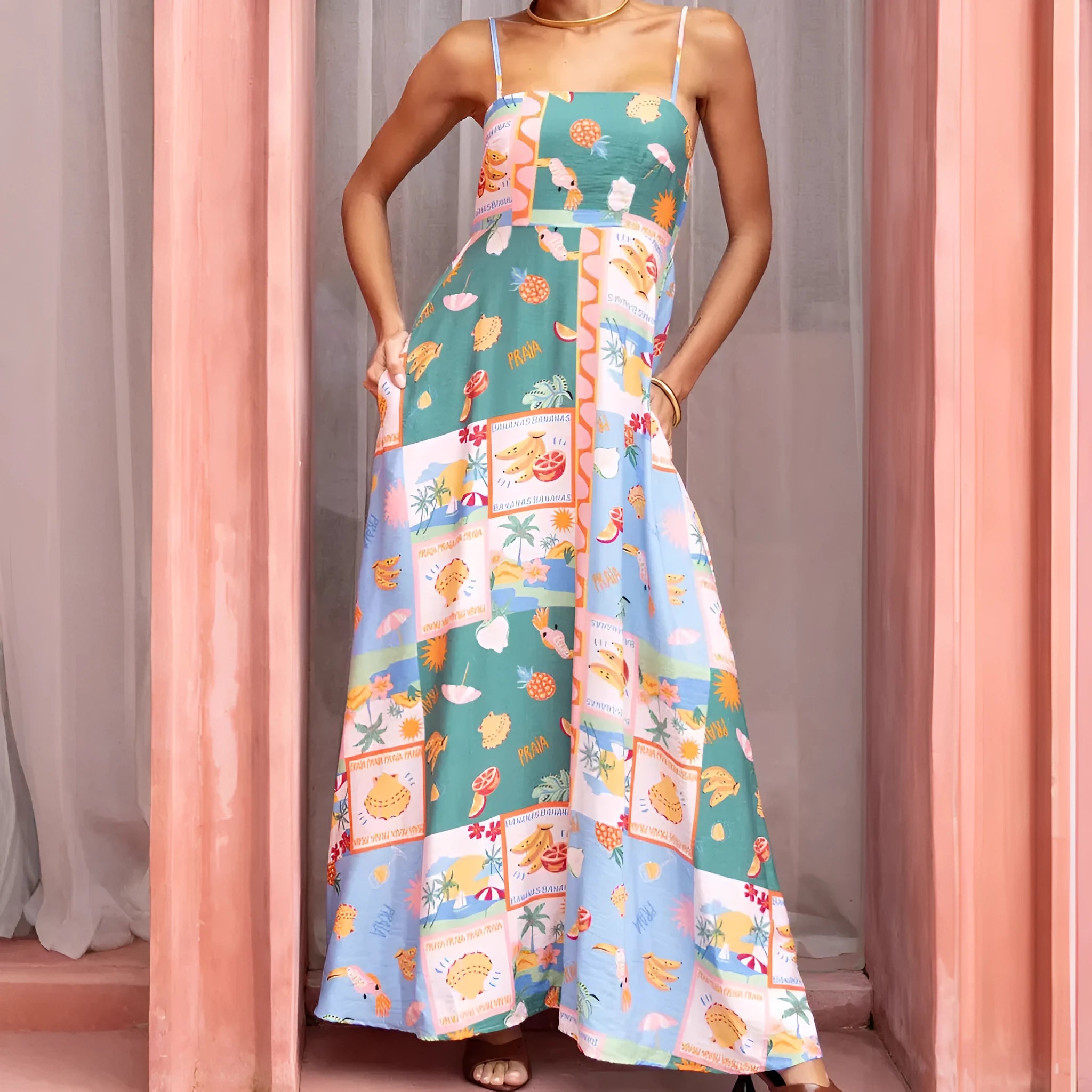 Women's green printed flared strap sleeveless long polyester dress with pockets on a model
