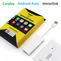 Black and white CarPlay USB adapter module for car stereo phone integration.