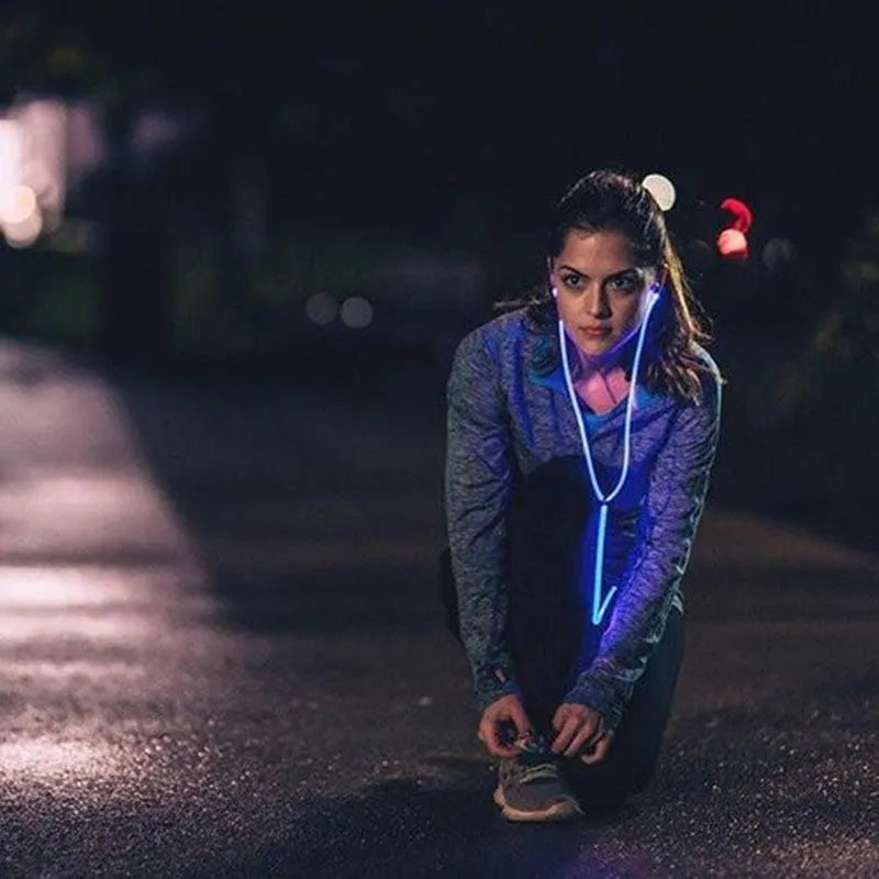 Blue LED light-up earphones with a remote control, compatible with iPhone and Samsung phones.