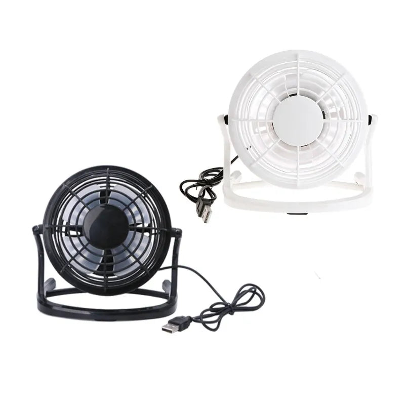 Compact black mini USB desk fan with adjustable tilt head on a wooden desk.