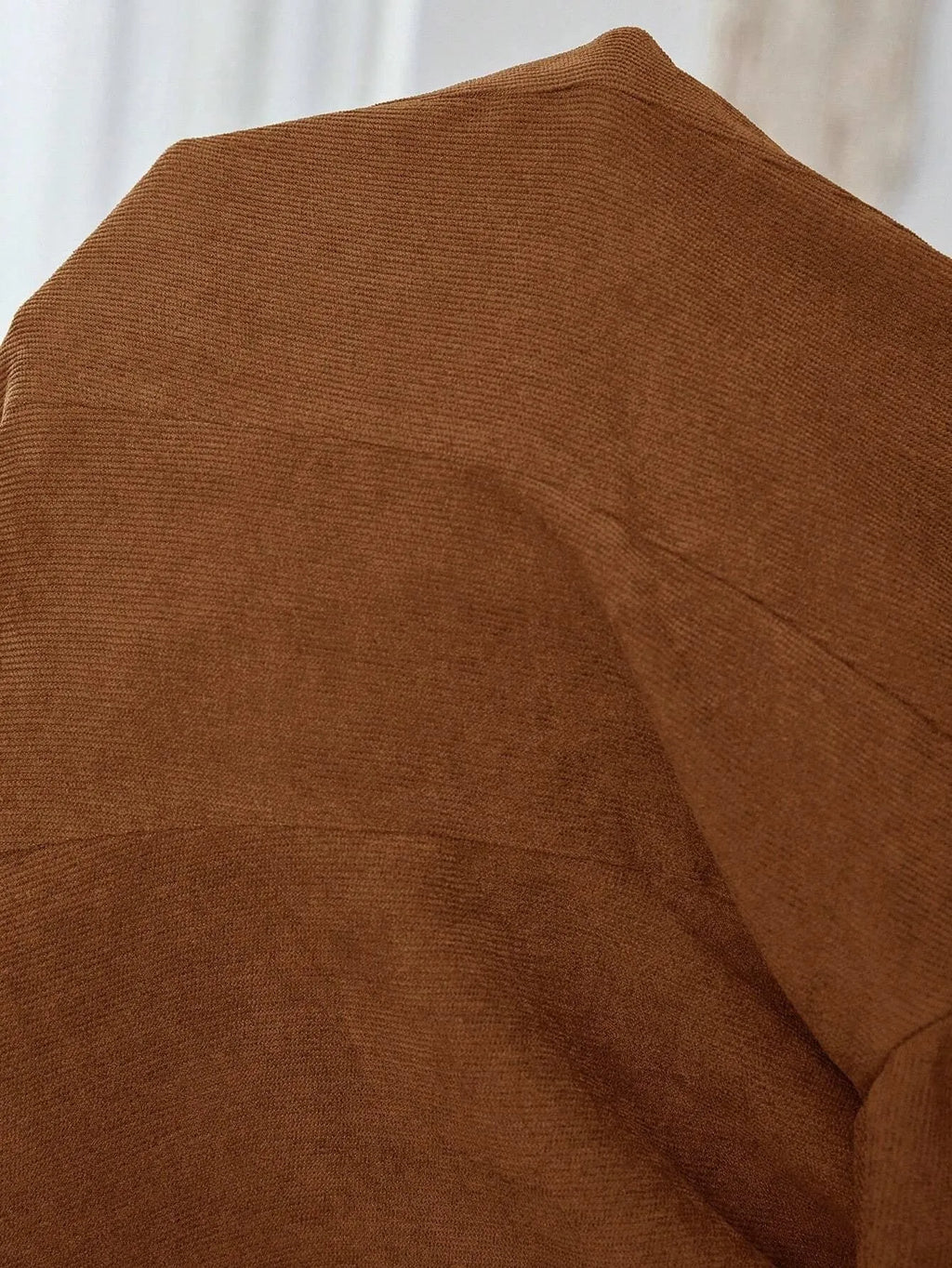Brown men's long sleeve single-breasted suit coat with a lapel collar.