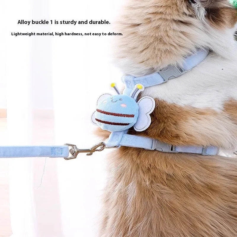 Colourful bee-shaped cat leash with teddies on a pink background.