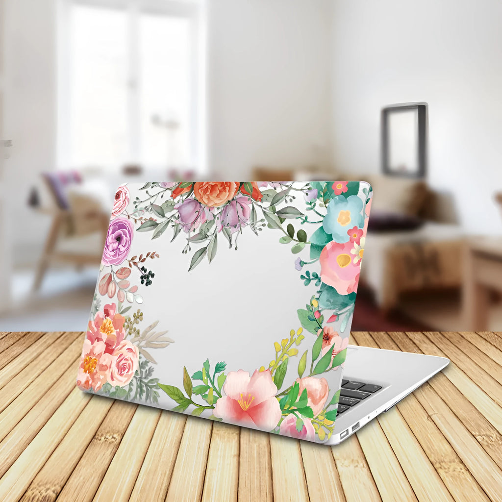 MacBook protective shell with floral pattern design covering laptop top and bottom surfaces