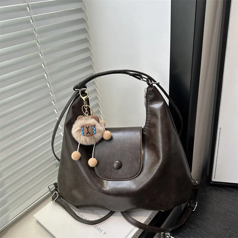 Large capacity textured PU commuter backpack with horizontal square shape and single shoulder strap