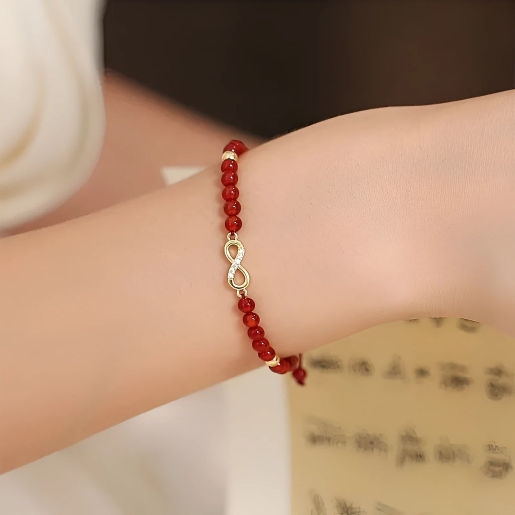 Hand-woven natural red agate bracelet showing diamond-shaped beads in ethnic woven pattern
