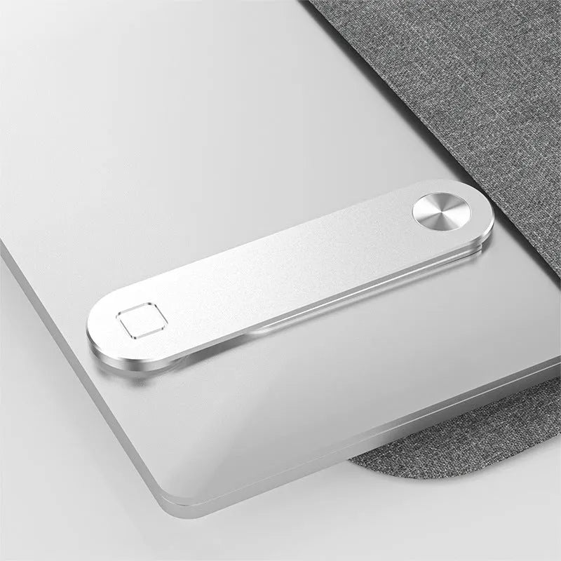 Black aluminium laptop phone holder with magnetic mount attached to laptop side displaying smartphone