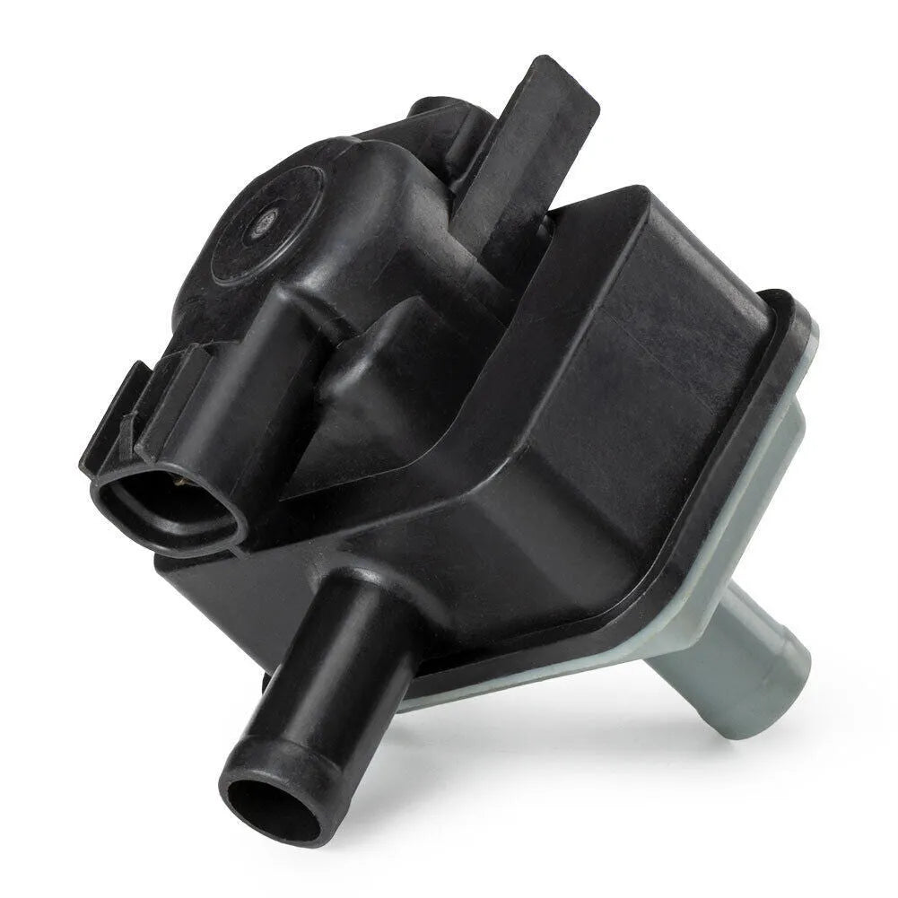 Black Toyota vacuum solenoid valve with model number 90910-12283 visible