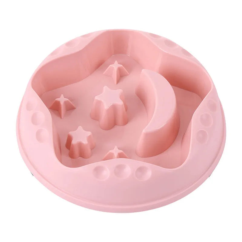Blue slow feeder dog bowl with moon and star wing design and internal maze pattern.