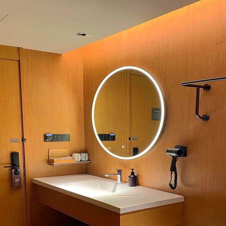 Round black aluminium frame LED bathroom mirror mounted on wall with touch control for light.