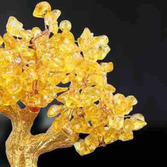 A citrine-coloured resin decorative ornament of a small water turtle and a money tree in Chinese style.