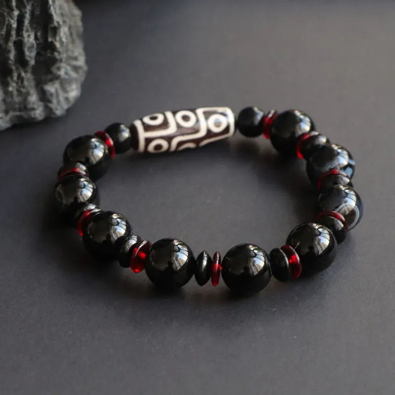 Hand-woven black agate Dzi bead bracelet with 11mm geometric chalcedony beads