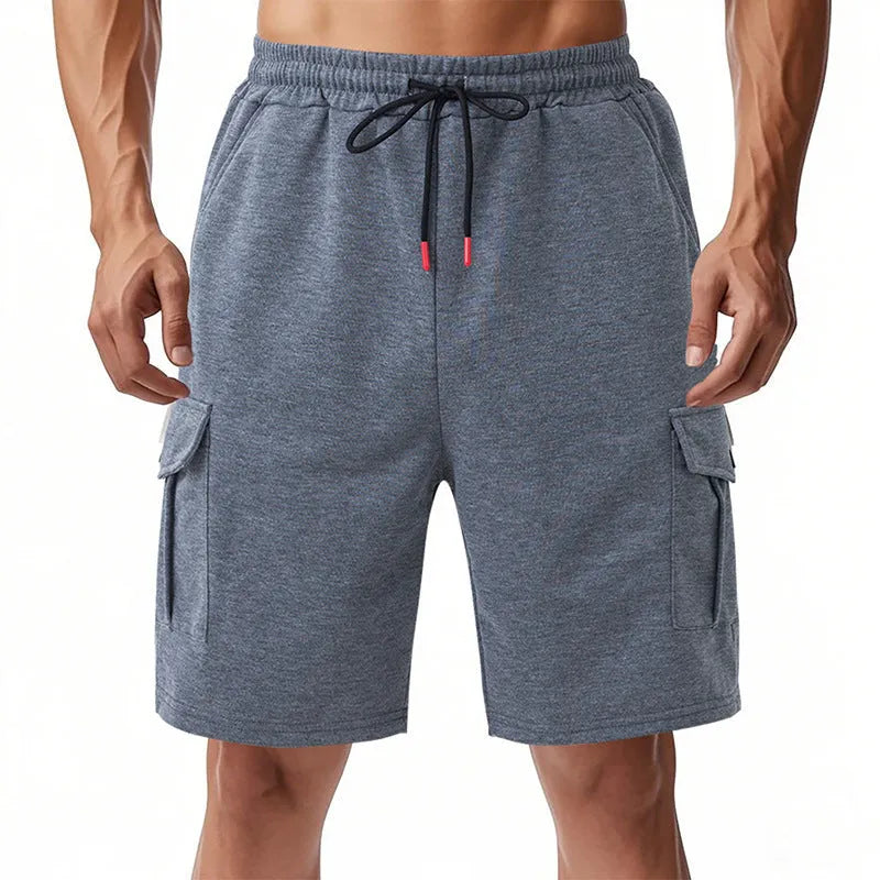 Men's loose grey terry fabric cargo shorts with multiple pockets on a hanger.