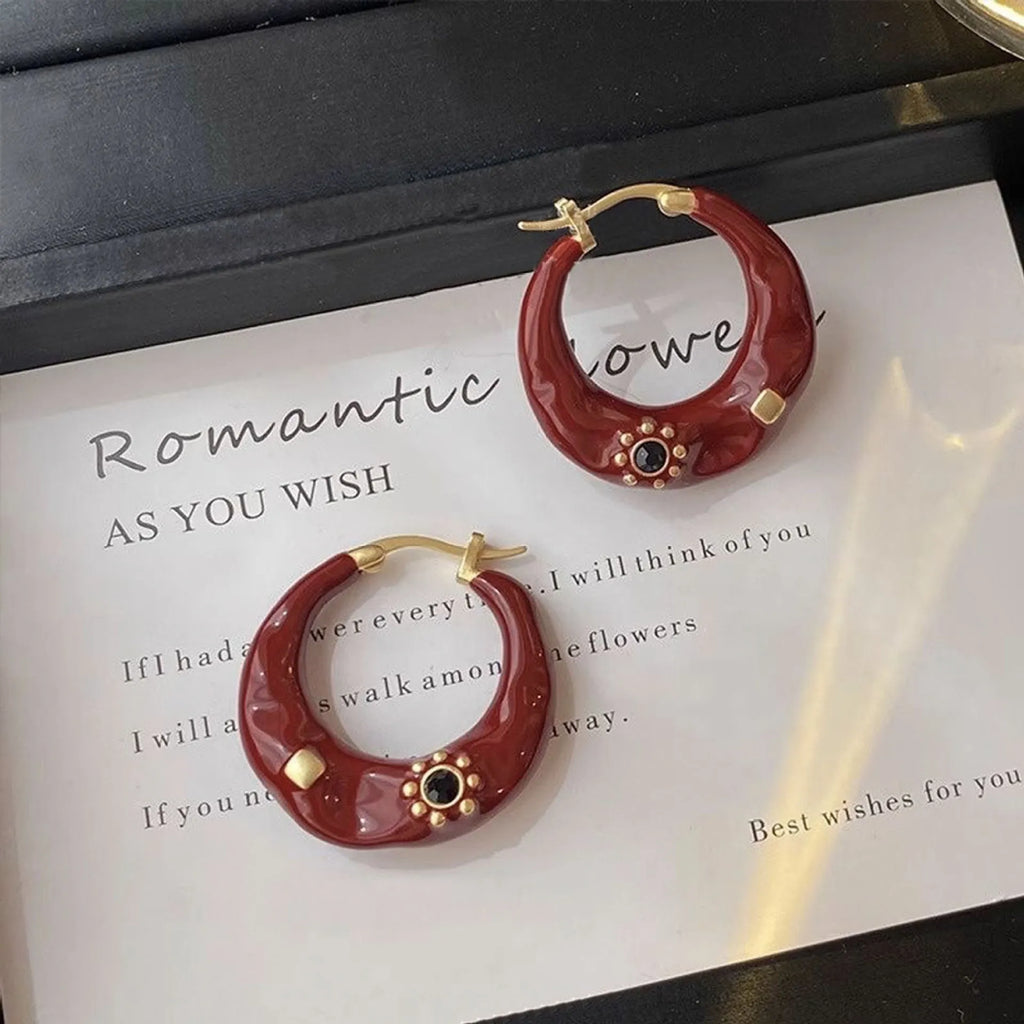 Hong Kong style retro ear studs with rhinestone inlay and dripping oil finish in black and red colours