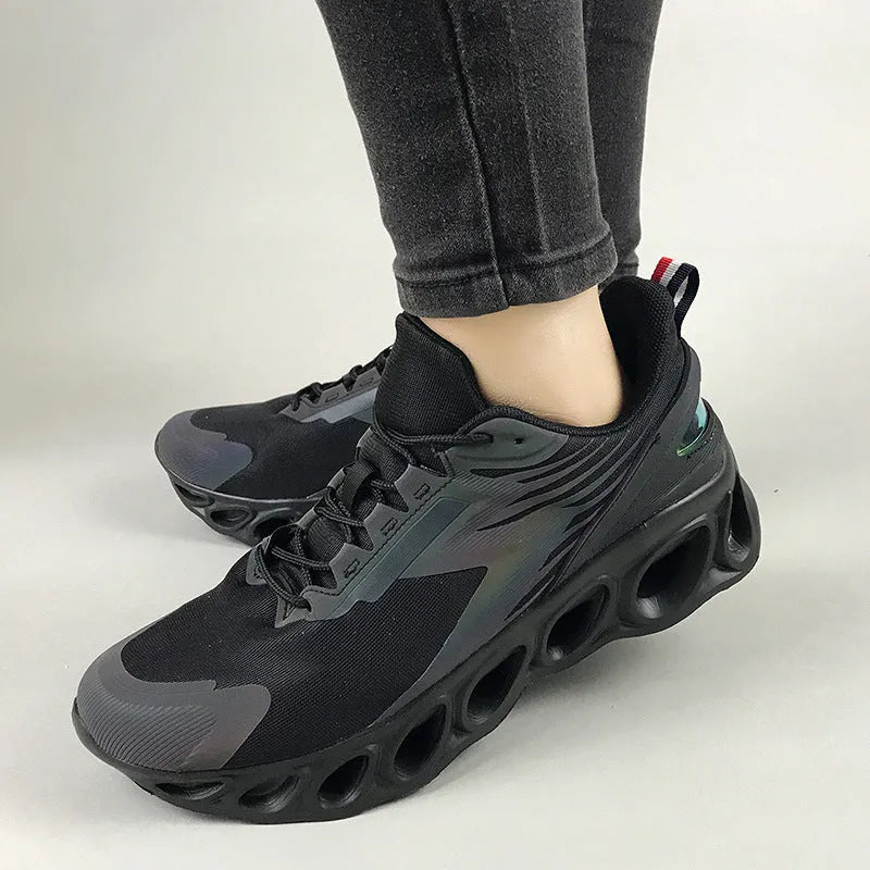 Breathable low-top lace-up casual trainers in black, white, and dark blue colours on a white background.