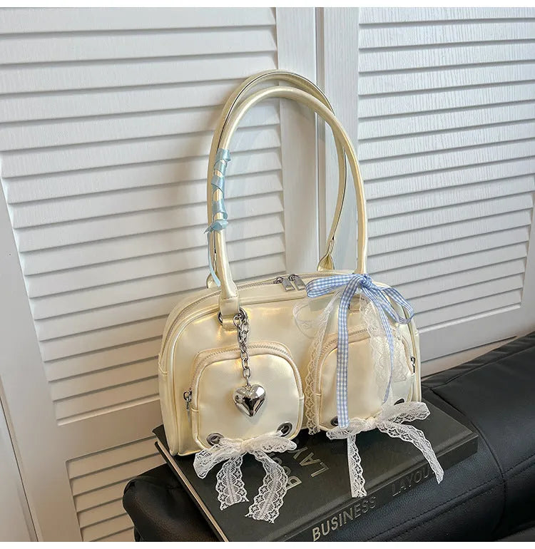 Beige PU shoulder bag with double straps and phone compartment showing structured square shape