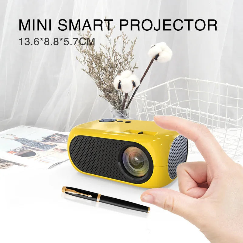 M24 portable micro mini LED projector in gold or white colour on a grey background