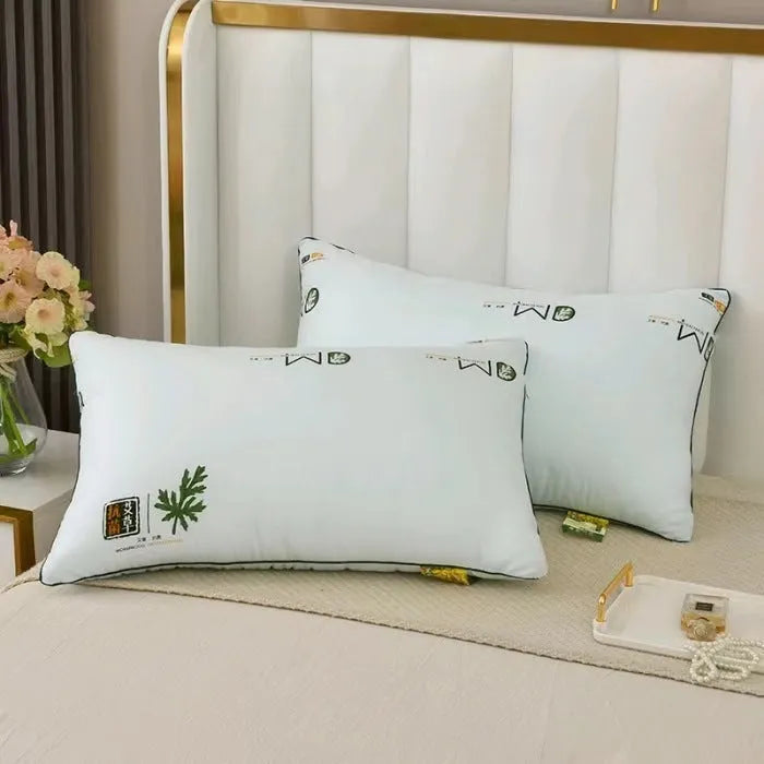 Polyester chemical fibre pillow core in light blue on a bed, showing its plump fill.