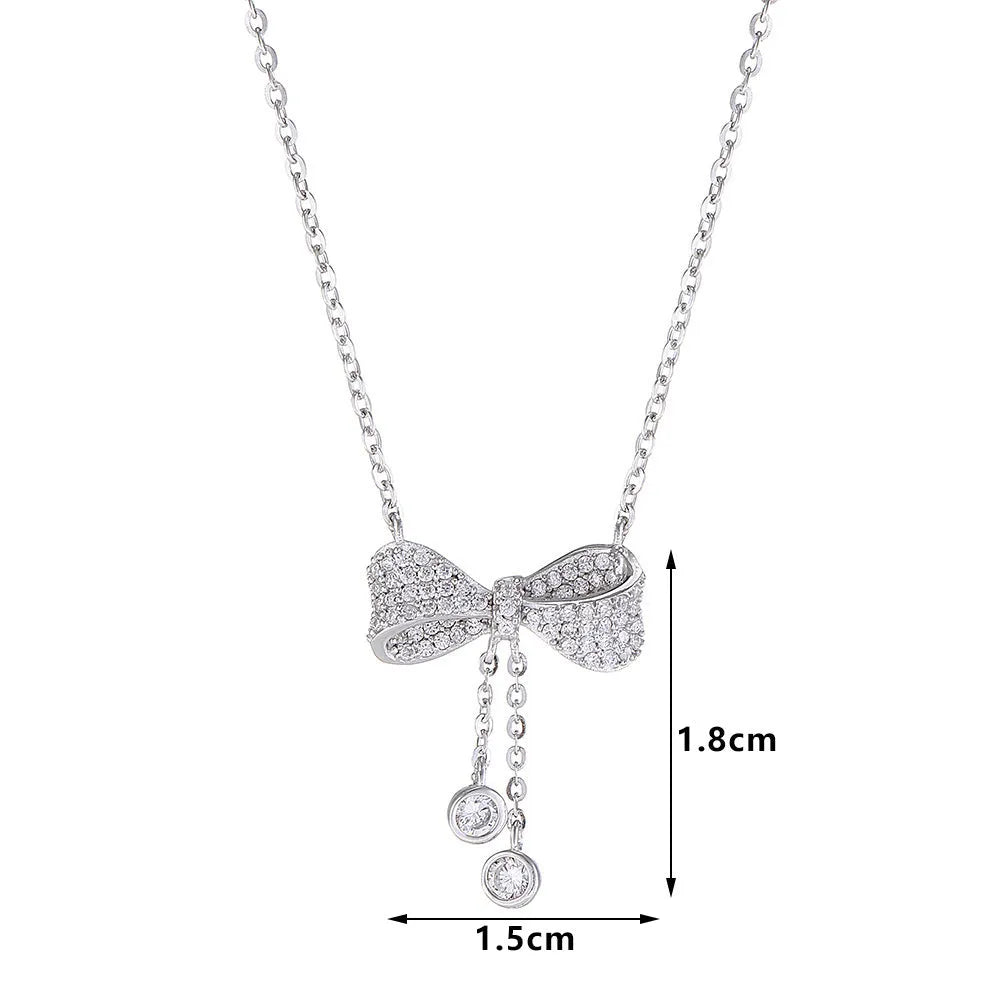 S925 sterling silver necklace with a bow pendant on an adjustable O-ring chain.