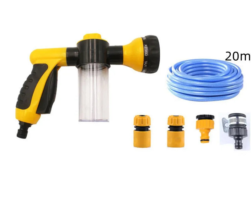 Green high-pressure foam spray gun with adjustable nozzle and attached water hose for car and garden cleaning.