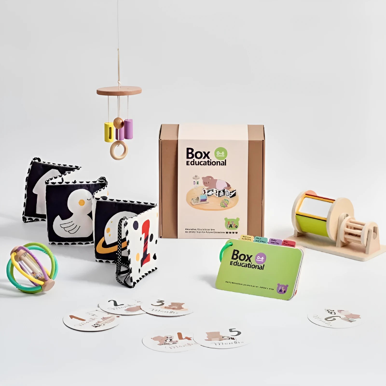 Educational wooden Montessori rattle set with black and white cards and ball chime in colour box packaging