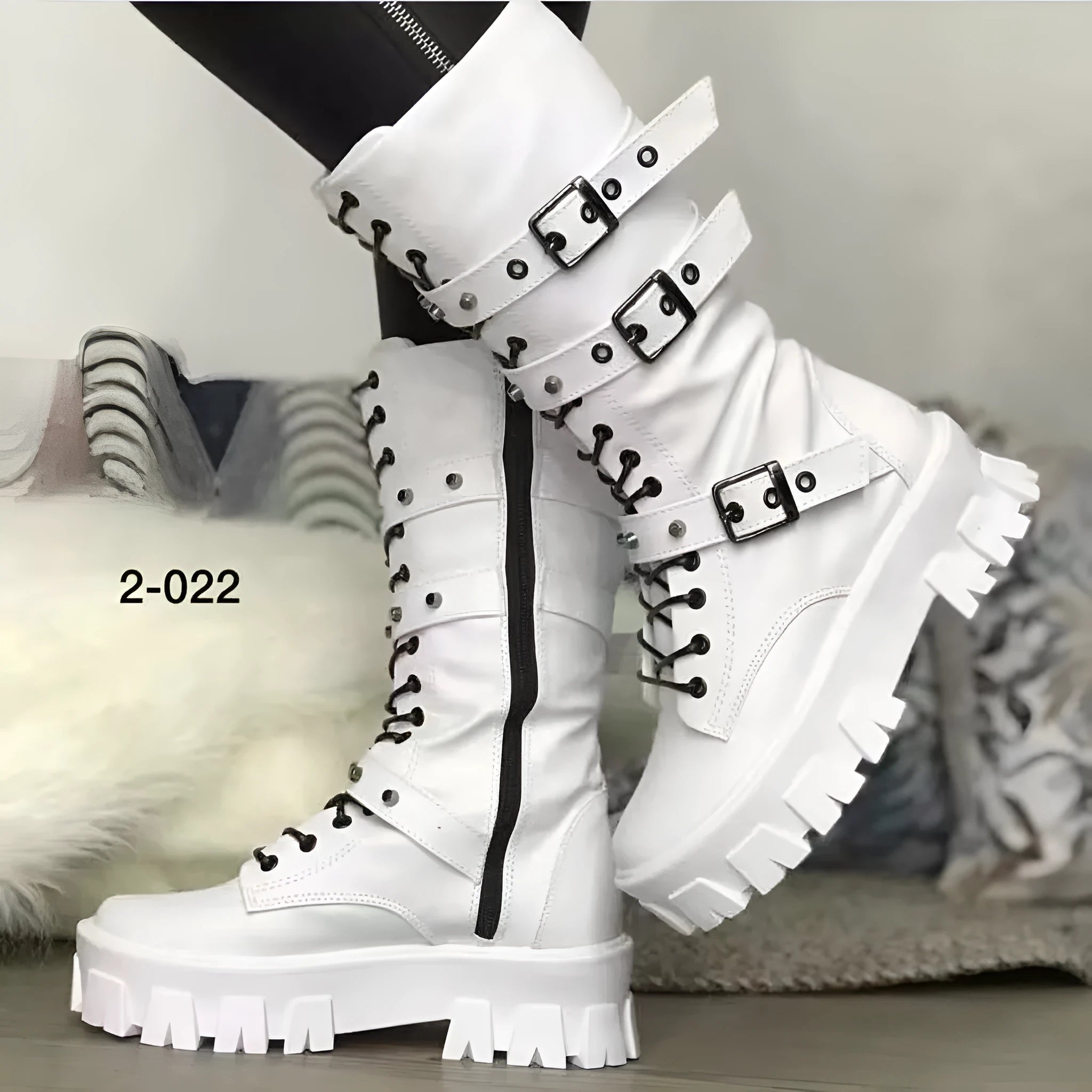 Black women's mid-calf boots with a metal buckle strap and side zip on a round toe.