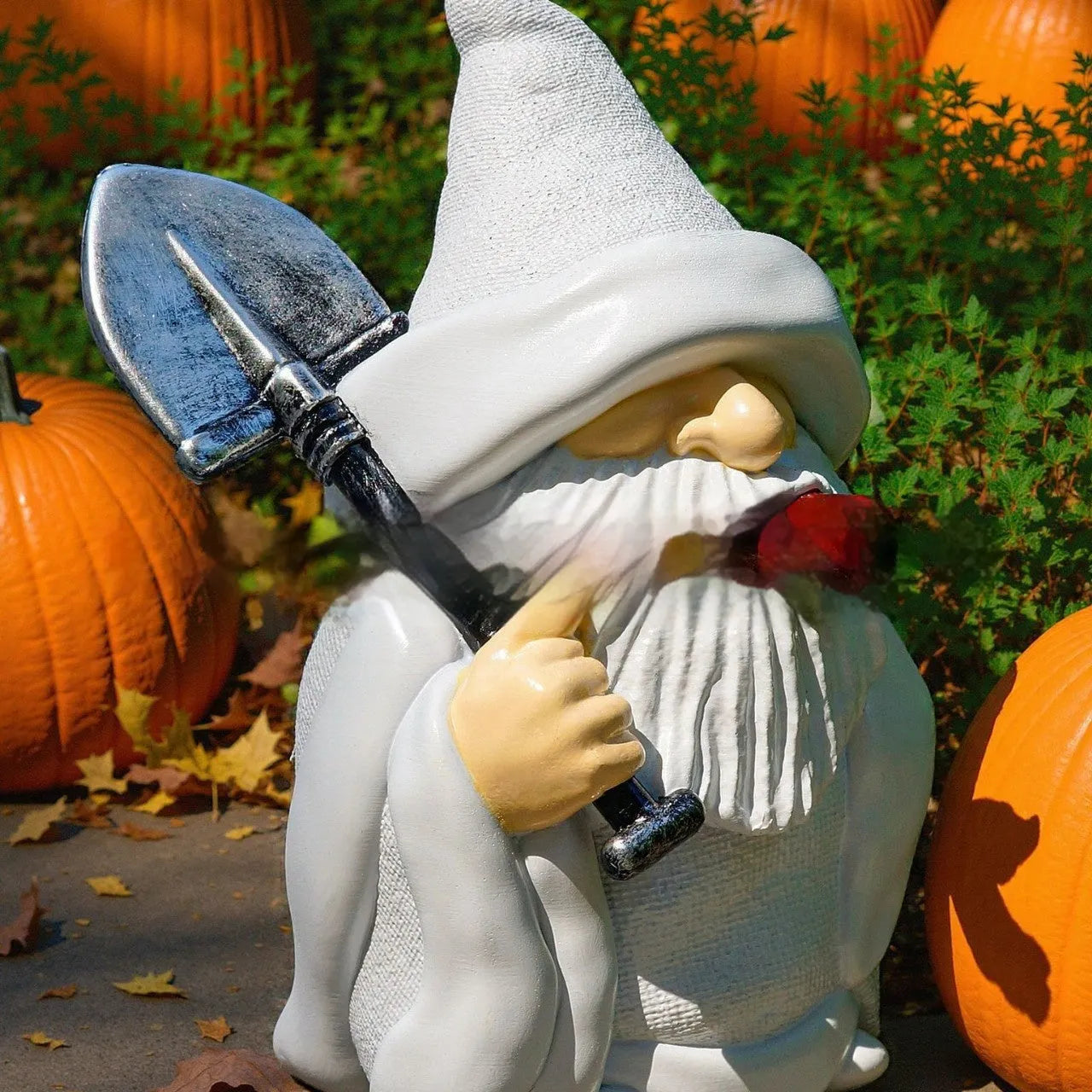 Christmas garden resin ornament depicting pipe dwarf figure holding smoking shovel