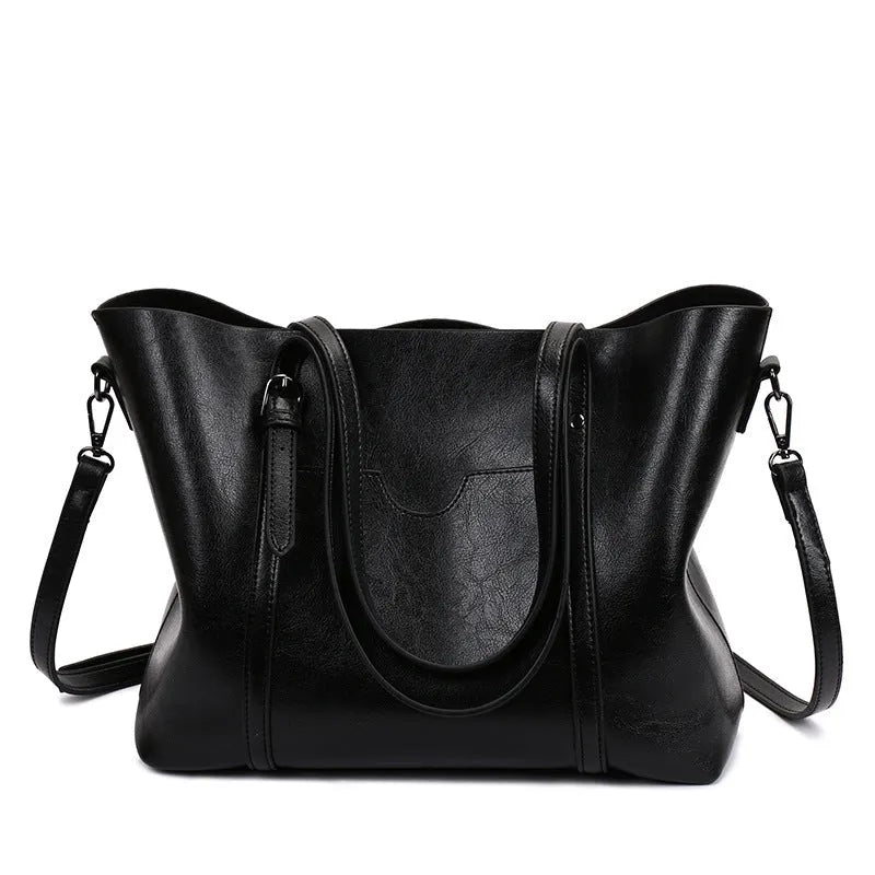 Retro-style women's messenger bag in multiple colours, showing large main compartment suitable for an A4 magazine.