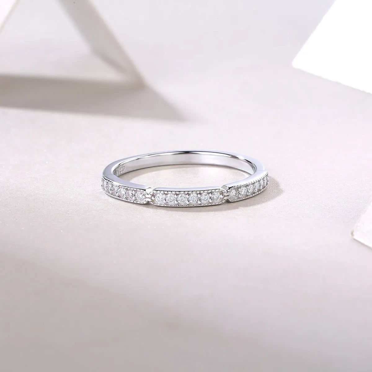 Moissanite wedding ring set in S925 silver with platinum plating, shown in golden, platinum, and rose gold finishes, sizes 5 to 9, with gift box and GRA certificate